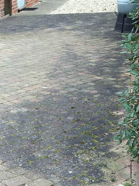 Block paving parking area path before cleaning